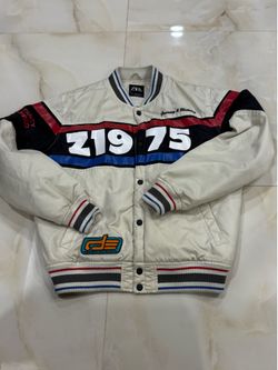 Zara men's cream racing jacket features "1975" graphics and blue and black stripes.
