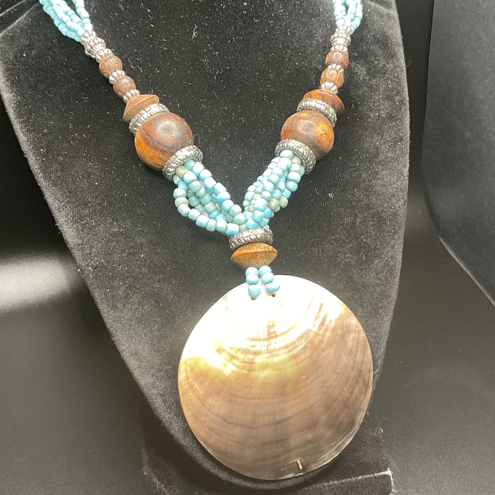 20” Turquoise And Wooden Beaded Necklace With Large She’ll Pendant