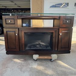 TV console with faux fireplace. 60”L 20” W 36” H. Must pick up