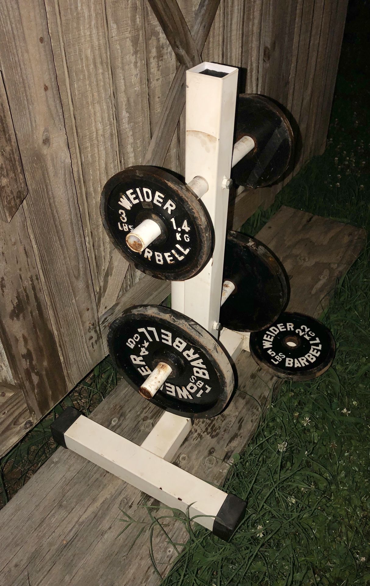 1970’s is Vintage Weider Barbell Weights & Weight Holder. there is 132 lbs in all.