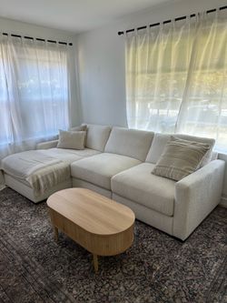 Beautiful Ashley 3-piece modular sectional in a soft cream/ivory color