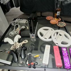 “Nintendo Wii Console Bundle with Controllers, Cables, Wheels, and Games”