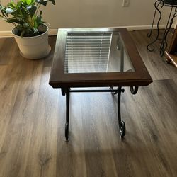 Two glass and wood end tables