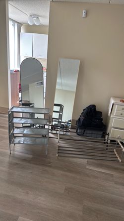 Two floor mirrors and three shoe racks