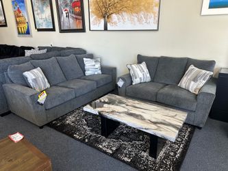 Gray sofa and loveseat
