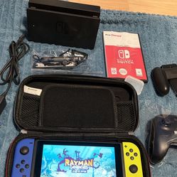 Nintendo switch with docking station, charging cord, Joycon grip, extra controller, 2 games mxgp3 and rayman magic and case. Cash only no trades 