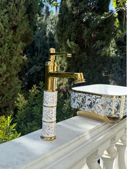 Luxurious porcelain sink with gold handles