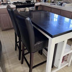 For sale: Set of two bar stools. Dark brown faux leather with dark wood legs.
