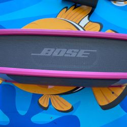 Used Bose sound link mini 2. NEEDS NEW BATTERY. Good Working Condition. Comes With Pink Cover & Charger. Price negotiable. From my non-smoking home. 