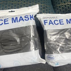 2 packs of disposable face masks each pack have 100pcs