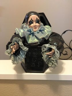 Porcelain clown doll music box