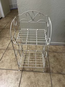 Folding stand  Metal 27 inches tall  14 inches long 1 ft wide