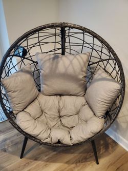 Indoor/outdoor lounge chair with cushions.