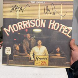 Signed by John Densmore, drummer of the doors and Robbie Krieger guitarist of the doors
