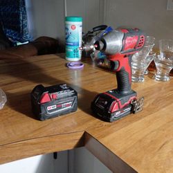 Milwaukee Impact W/ 5amp And 2am Batteries 