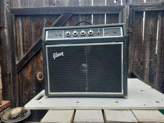 vintage 1970s Gibson G-10 solid-state guitar amplifier, recognizable by its distinct "Gibson" logo and vertical control panel.