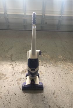 White and black upringt vacuum cleaner