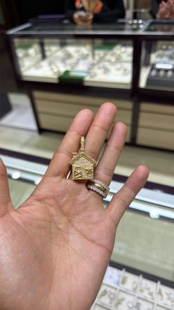 Gold diamond pendant trap house