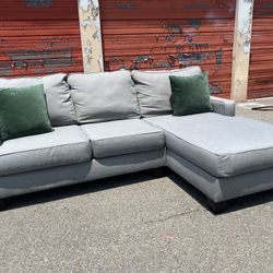 Ashley’s Gray Sectional Sofa Couch with right facing chaise