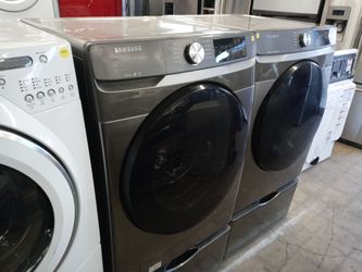 Samsung gray front load washer and dryer set on pedestals - Free delivery