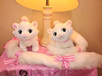 Aristocats marie two plushes about 14 inches tall eith long tails from Disneyland. Asking $10 takes both of them together as a set