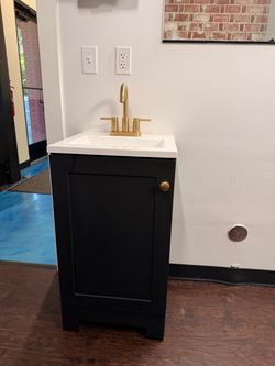 Black Vanity with Sink & Gold Faucet