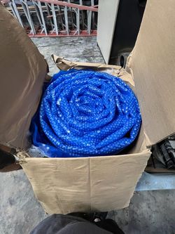 Blue Solar Pool Cover Rolled Up