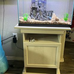 Fish Aquarium Fish aquarium includes castle, lights,power filter,Aquarium solution,food, bubble machine all included. Brand new  air filter