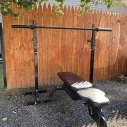 Pair Of Squat Stands And A Black 6’ Olympic Barbell 