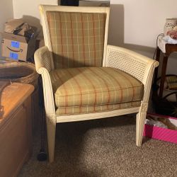 Lovely Chair with Rattan sides and tan, and burgandy cushions