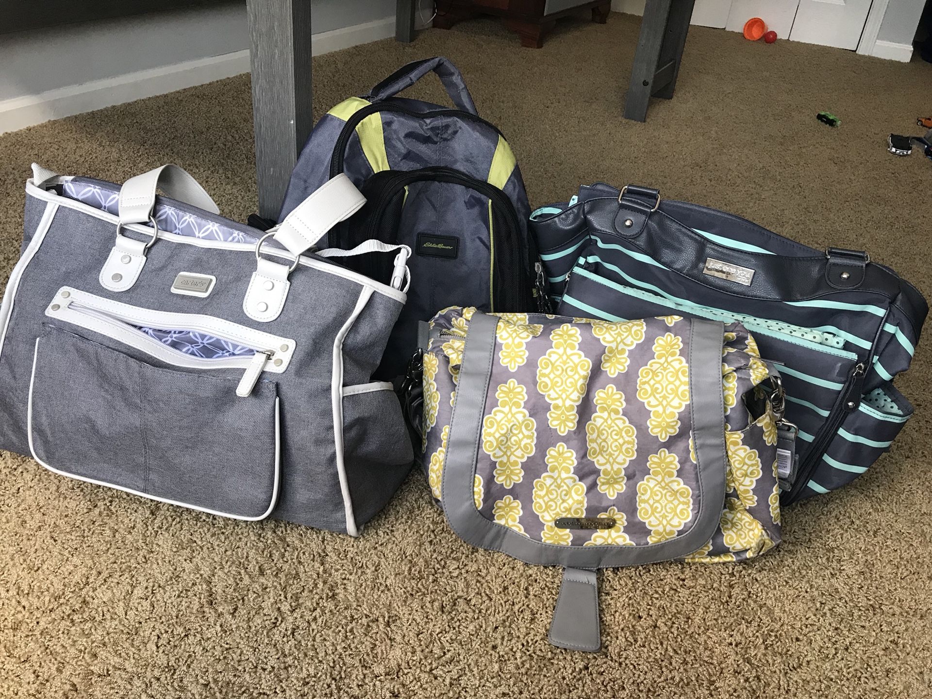 Baby diaper bags and changing pads
