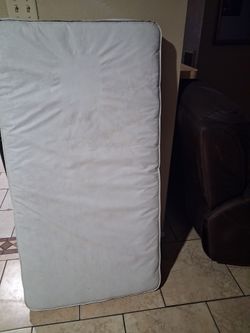 Crib mattress no tear in good condition clean