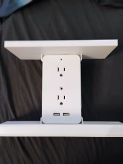 Bathroom shelf plug in with 6 outlets and phone chargers.