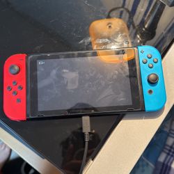 Nintendo Switch with Extra controllers,chargers, Memory Card, And Lots Of Games