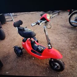 SCOOTER ELECTRIC TRAE TODO PERO NO CARGA