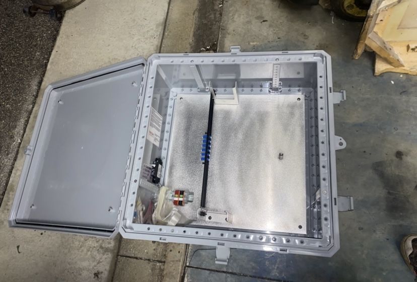 Ventev Fiber optics poly case enclosure 24x24x10 brand new in opened box with back plate and breakers and lock with wires and other items in box Origi