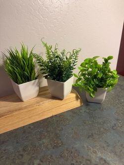 Small pots with artificial plants