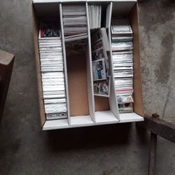 Box of football, baseball, and basketball cards