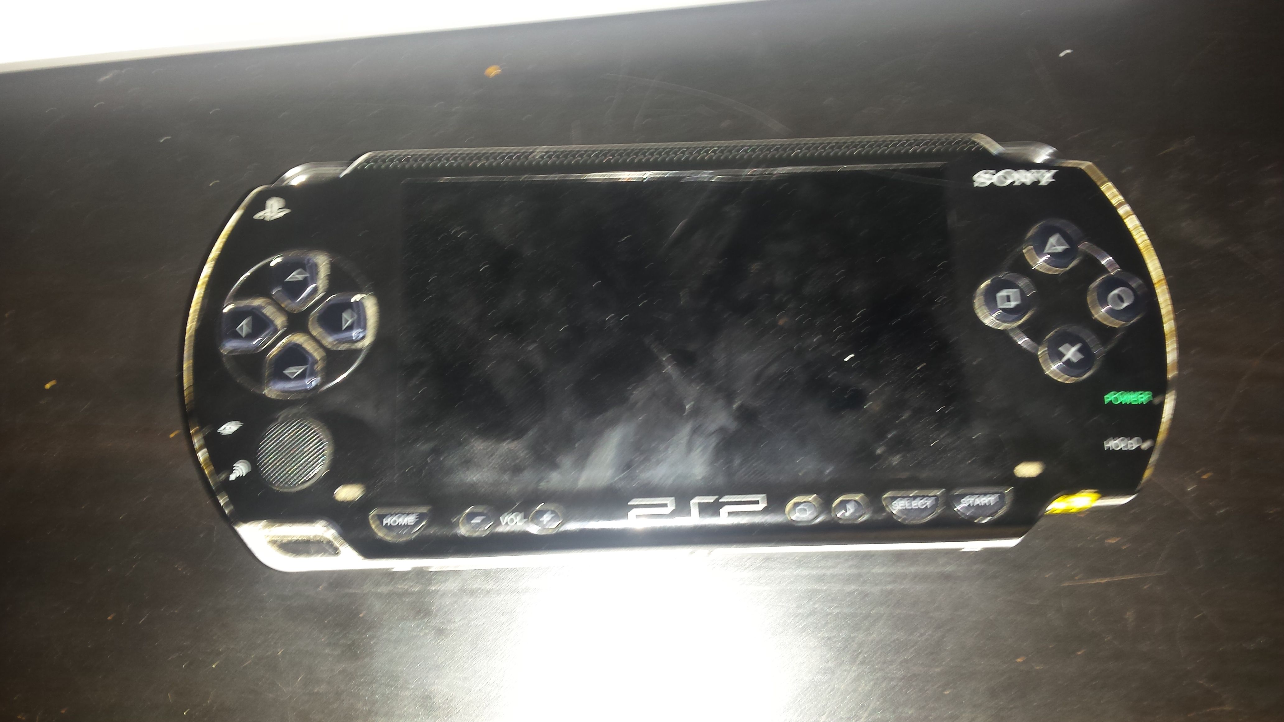 Psp with charger and game metal gear