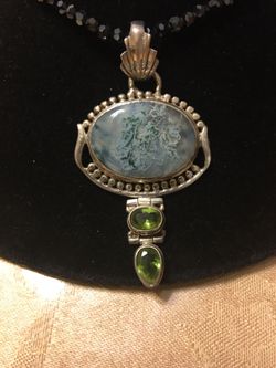 Gemstone Brooch with peridot stones set in sterling silver with black crystal necklace