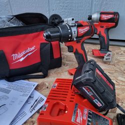 Milwaukee m18 Cordless Brushless hammer drill, Impact Driver, 4ah battery, Charger and Bag 
