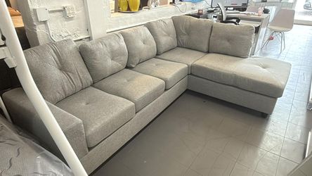 Sectional sofa for your living room. In gray and black. $100 down payment. Ask for price.
