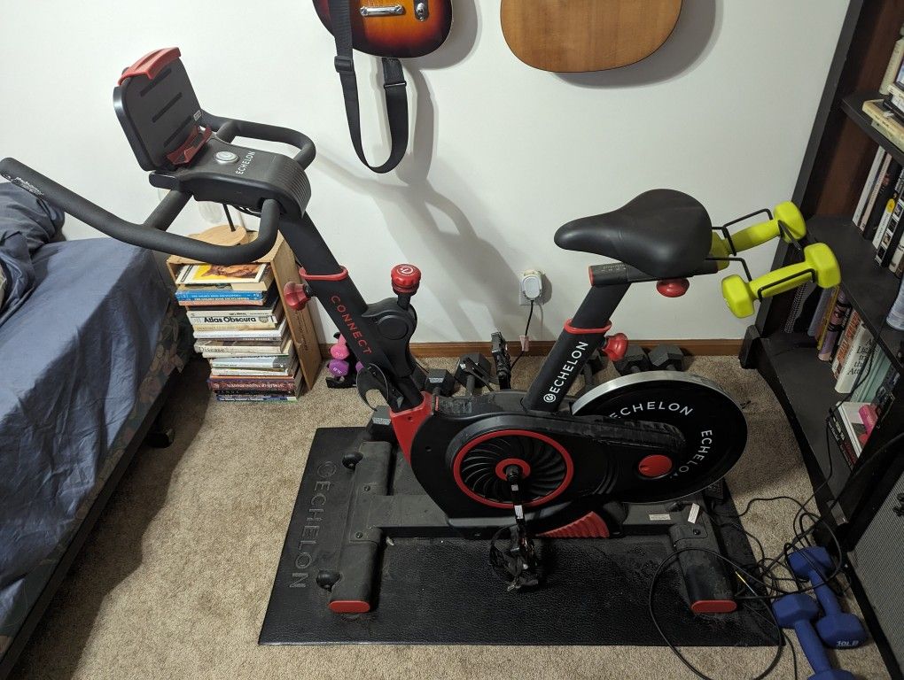 Spin Bike, Floor Mat, And Heart Rate Monitor 