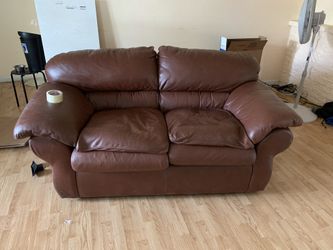Leather loveseat and 40” tv console