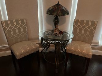 Small glass top table and 2 cushion chairs