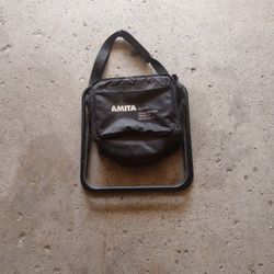 Cooler/Seat With Shoulder Strap