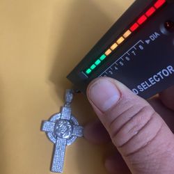 Semi-new silver cross with real diamonds featuring the Star of David, asking for $250 firm price, cash only.