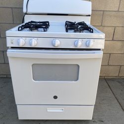 General Electric 4 Burner Stove And Oven  