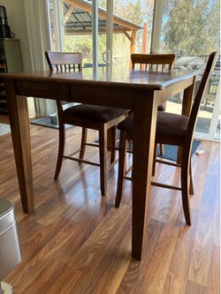 Solid wood dining table and 6 chairs