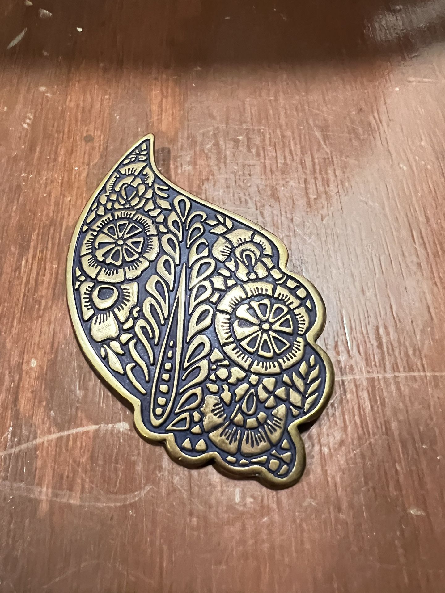 Bronze Raised Design Brooch Pin On Black Paisley Shape 3 3/4” Floral Design